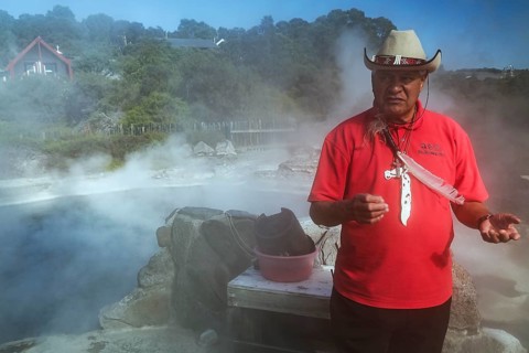 Maori guide shows how to prepare a hangi dish in Whakarewarewa, Rotorua, Bay of Plenty, New Zealand