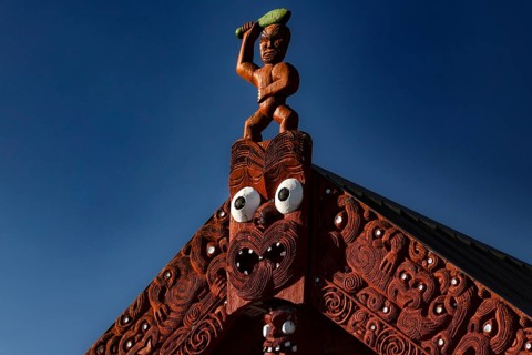 Detailed carved marae roof in Whakarewarewa village, showing traditional Maori architecture,