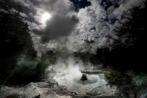 Steaming geothermal area near Waiotapu with active mud springs and dramatic skies, Waiotapu, Bay of