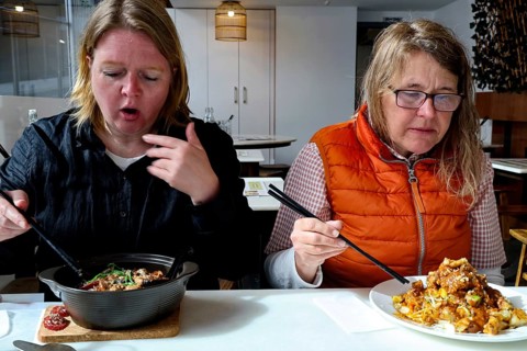 Two woman enjoy a meal at Penang restaurant in Wellington, Wellington, North Island, New Zealand