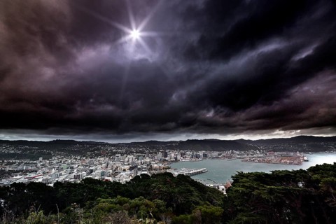 View of Wellington and the ocean from Mount Victoria Lookout under dramatic cloudy sky, Wellington,