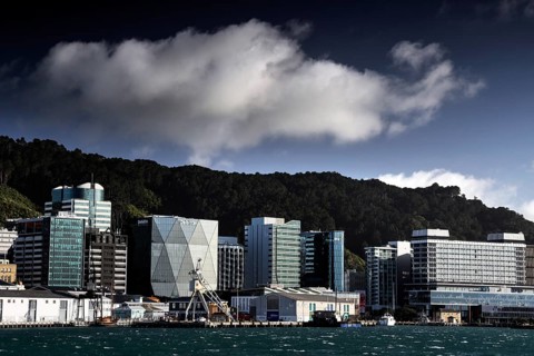 Modern building front on Wellington Waterfront under dramatically cloudy sky, Wellington, New