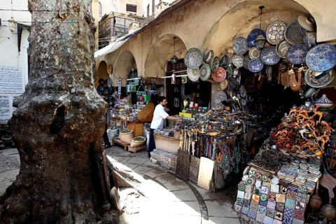 Market scene in Place Neijarine with artisanal ceramics and traditional goods, Fez, Fès-Boulemane,