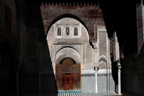 Magnificent Medersa Attarine architecture with ornate wooden doors and decorations, Fez, el-Bali,