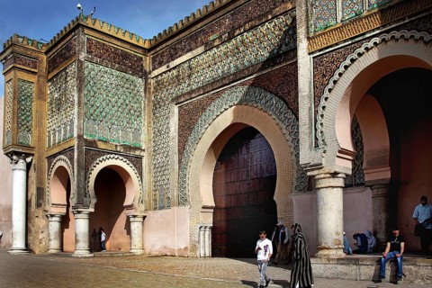 Detailed patterns on a large, impressive gate, people nearby, Meknes, Fès-Meknes, Morocco