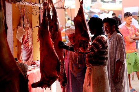 People buy meat in the meat souk of Guelmim, Guelmim, Guelmim-Oued Noun, Morocco