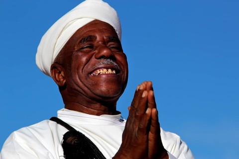 A man smiles happily at the traditional Berber festival, Ma El Kelâa m'Gouna, Fête des Roses,