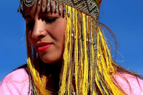 Close-up of a woman wearing a traditional headdress at the Berber festival, Ma El Kelâa m'Gouna,