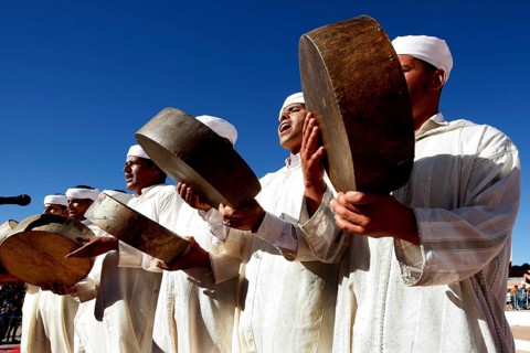 Men in traditional clothing play drums at the Fête des Roses, El Kelâa m'Gouna, Drâa-Tafilalet,