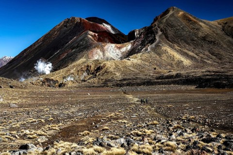Rugged volcanic landscape of the Tongariro Alpine Crossing with two distinctive peaks, Tongariro
