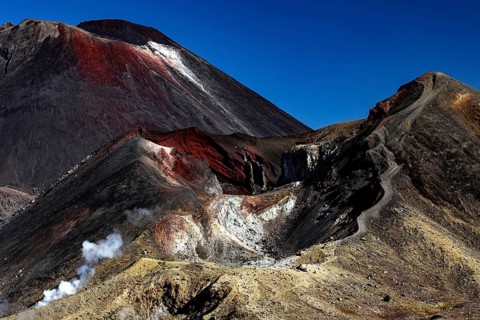 The imposing peaks of Mount Tongariro and Mount Ngauruhoe under clear skies, Tongariro National