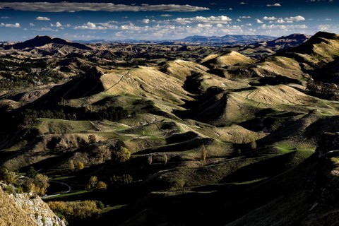 Panorama of Te Mata Peak with extensive mountain landscape under slightly cloudy sky