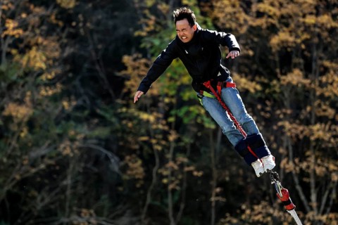 Free fall person bungee jumping in autumn, Queenstown, Otago, New Zealand