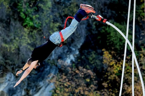 Person upside down in free fall from bungee jumping at Kawarau Bridge, Queenstown, Kawarau Bridge,