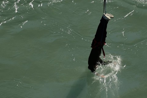 Single bungee jumper approaches the water of Kawarau Gorge, Queenstown, Otago, New Zealand