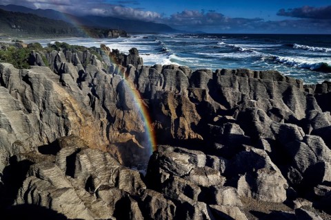 Pancake Rocks near Punakaiki with Rainbow and Blowhole, Punakaiki, West Coast, New Zealand