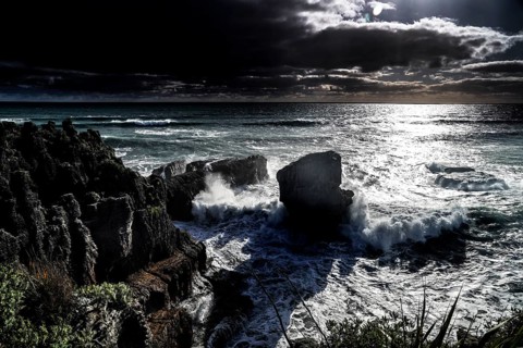 Moonlight over Pancake Rocks in Punakaiki, lined with powerful ocean waves, Punakaiki, West Coast,