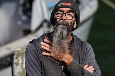 Elderly man with long grey beard delivering mail at Pelorus Mailrun