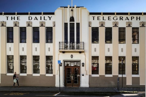Art deco façade of a newspaper building with distinctive columns, Napier, Hawke's Bay, New Zealand