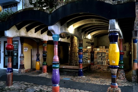 Colourful, artistic exterior view of the Hundertwasser toilet in Kawakawa, Kawakawa, New Zealand