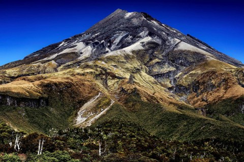 Impressive view of the summit of Mount Taranaki under clear blue skies in Mt Egmont National Park,