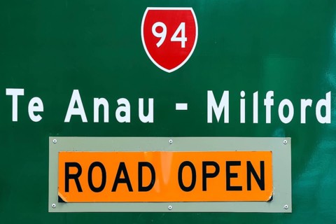 Traffic sign with directions to Te Anau - Milford, Milford Road, New Zealand