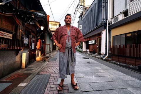 Man in yukata posing on a quiet street in Yamanouchi, Yamanouchi, Japan