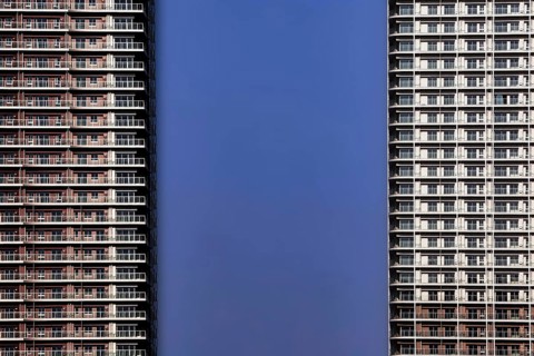 Skyscrapers with modern architecture against a clear blue sky, Tokyo, Tokyo Bay, Japan