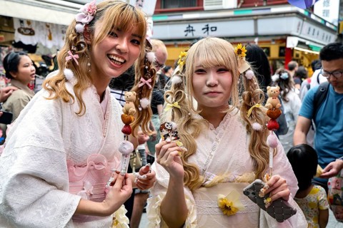 Two woman wearing white kimonos smile in Asakusa, Tokyo, Asakusa, Japan