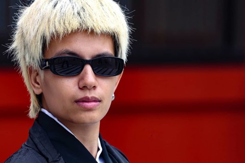 Young man with blonde hair and sunglasses in modern style, Tokyo, Asakusa, Japan
