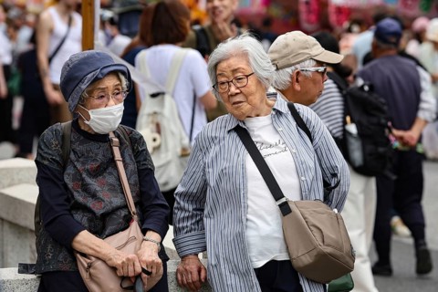 Two elderly woman talking on a busy street in Asakusa, Tokyo, Tokyo, Asakusa, Japan