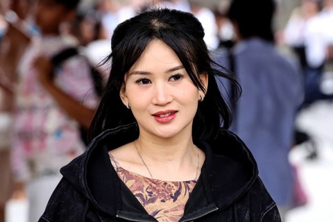 Smiling woman with black hair in busy street of Asakusa, Tokyo, Tokyo, Asakusa, Japan