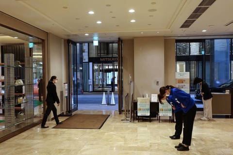 Entrance area of an elegant shopping center with visitors, Tokyo, Ginza, Chuo, Japan