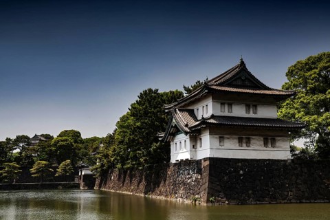 Imperial Palace wall with adjacent moat in peaceful surroundings, Tokyo, Japan