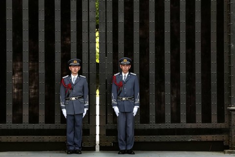 Guards in uniforms at the Imperial Palace gate during the changing of the guard, Tokyo, Japan