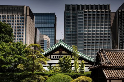 Traditional imperial palace gate in front of modern skyscrapers, Tokyo, Japan