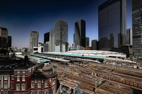 View of Tokyo Station from a roof garden with modern buildings, Tokyo, Japan