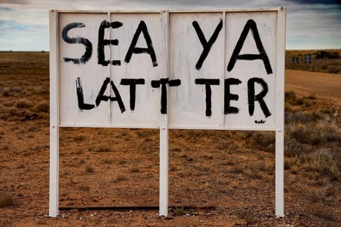 Ironic sign in a lonely desert area, dry and funny atmosphere, zero