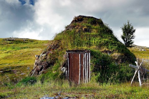 A traditional moss-covered seed hut in the countryside near Hammerfest, Hammerfest, Finnmark,
