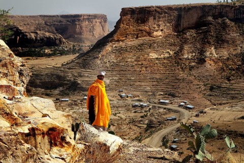 Abba Philippos looks out of the vast countryside from a cliff, Debre Damo, Tigray, Ethiopia