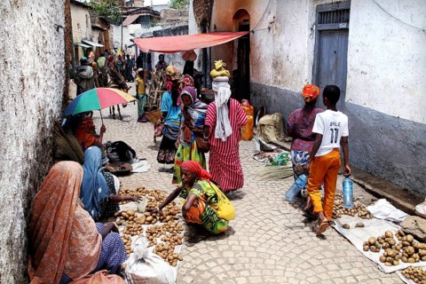 Market scene in an alley in Harar with colorful clothes and goods, Harar, Ethiopia