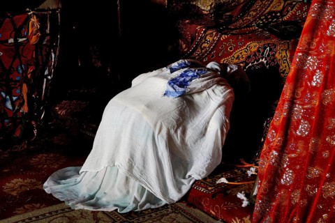 Worshippers inside Debre Berhan Selassie church, wrapped in cloth, in Gondar, Gondar, Ethiopia