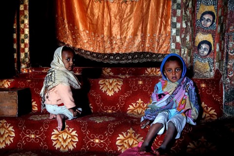 Two children in the traditional setting of Debre Berhan Selassie church, zero
