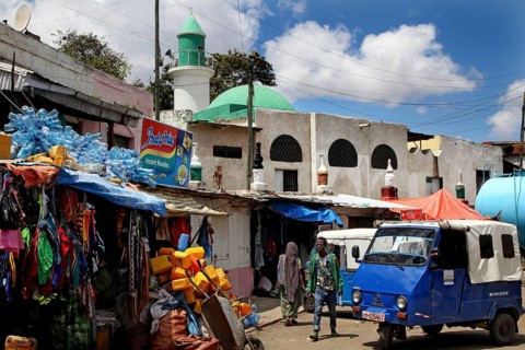 Lively old town of Harar with shops and market stalls under blue skies, Harar, Harari, Ethiopia