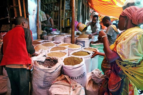 People shop at a lively spice market in Harar, surrounded by colorful spices, Harar, Harar,