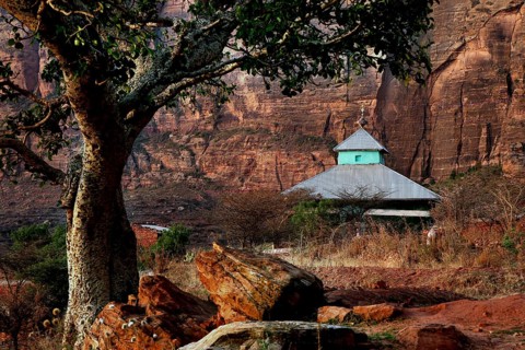Traditional church in Hawzien nestled in impressive rocky landscape, Hawzien, Tigray, Ethiopia