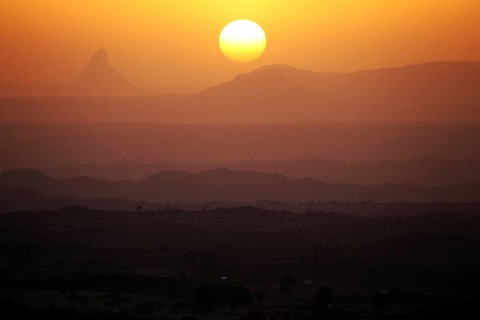 Sunset over a hilly landscape with intense warm colors, Hawzien, Gheralta, Ethiopia