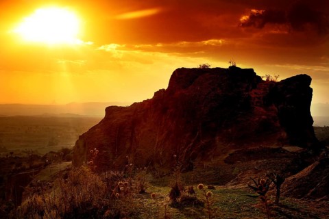 Rock formation at sunset creates a breathtaking landscape with golden sky tones, Hawzien, Tigray,