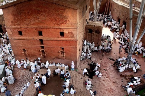 People gather around Bete Maryam church during a ceremony, Lalibela, Ethiopia