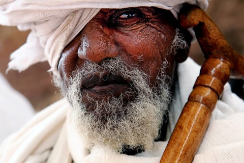 Portrait of an elderly man wearing a turban, deep in thought, Lalibela, Amhara, Ethiopia